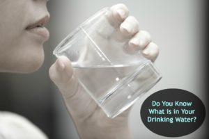 woman drinking glass of murky water
